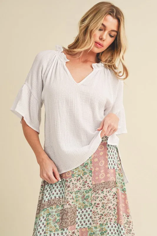 Aemi   Co Side Slit Notched Ruffled Half Sleeve Blouse