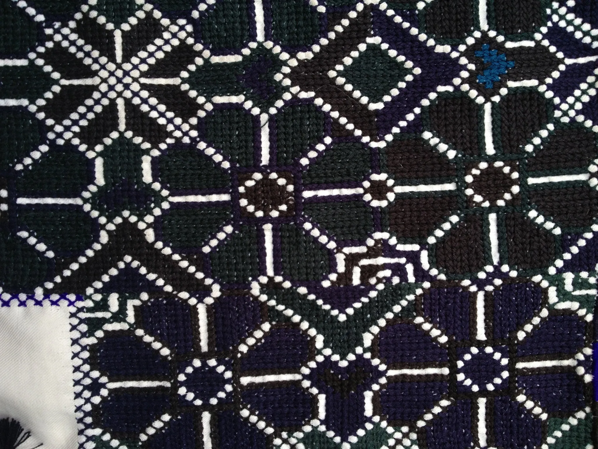 Black  and Green  cross-stitched blouses in the San Juan El Bosque style
